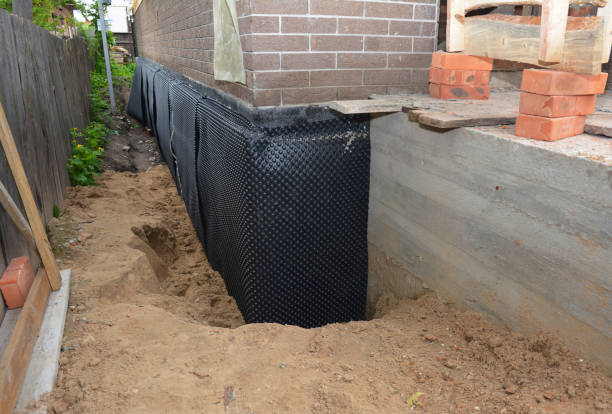Happy homeowners after waterproofing job in Hebron